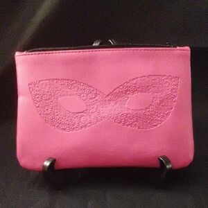 Elegant Pink Cosmetic Bag with Embossed Mask Design